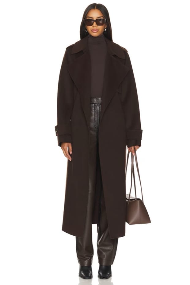 A chocolate wool trench coat, worn by a model